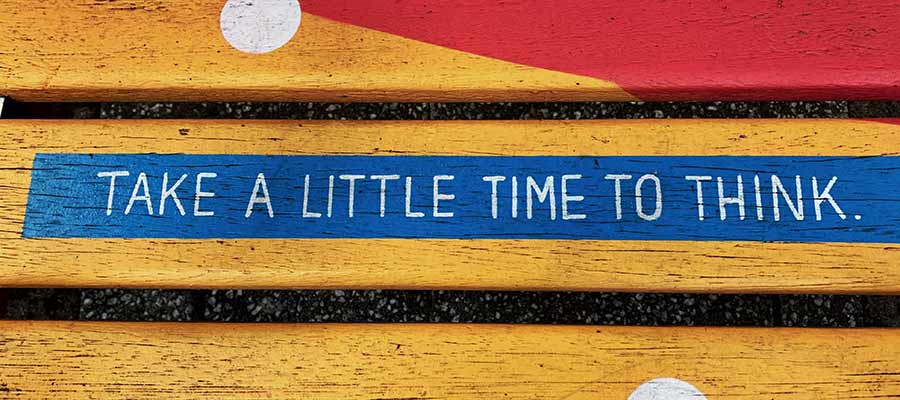 A sign that reads: "Take a little time to think"
