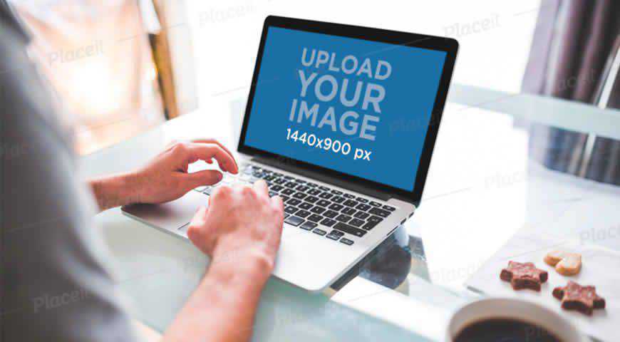 Man Working on a MacBook Pro PSD Mockup Template for Photoshop